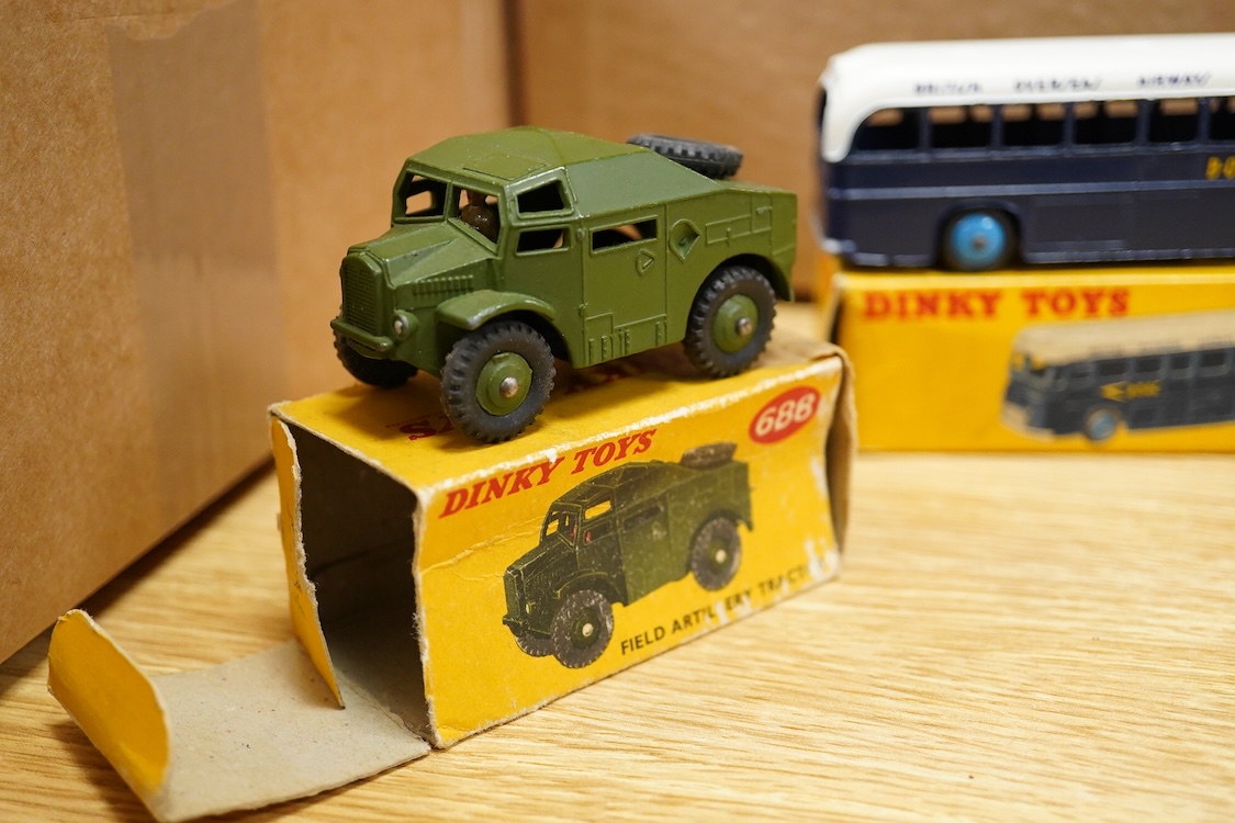 Eight boxed Dinky Toys; Royal Mail van (260), Leyland Atlantean bus (292), Atlas Copco Compressor Lorry (436), Standard Atlas Kenebrake (295), BOAC coach (283), Streamlined Fire Engine (250), Field Artillery Tractor (688